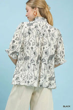 Umgee mixed print button front top featuring a black and white floral print blouse with ruffled sleeves