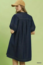 Indigo denim mini dress with notched puff sleeve and subtle stitching details by umgee with pockets