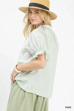 Umgee pinstripe light green and white ruffle sleeve blouse with v-neck and short ruffled sleeves for casual wear