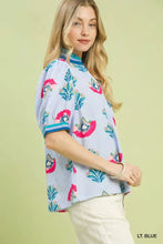 Light blue umgee print puff sleeve blouse with vibrant pink and teal floral embroidery and contrast trim