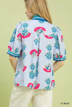 Light blue Umgee print puff sleeve blouse with vibrant pink and teal floral embroidery and contrast trim collar