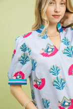 Light blue umgee print puff sleeve blouse with vibrant pink and teal floral embroidery and contrast trim