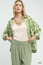 Umgee printed button down shirt featuring a green leaf patterned open-front jacket with a relaxed fit silhouette