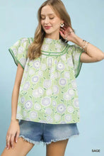 Light green retro floral smocked babydoll blouse with ruffled sleeves and a high neckline by Umgee Retro Floral