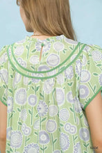 Light green sage umgee retro floral smocked babydoll blouse with white lavender floral pattern and ruffled sleeves