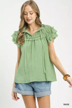 Sage-colored umgee ruffled flutter sleeve textured blouse with drawstring neckline and short ruffled flutter sleeves