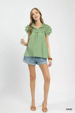 Sage green umgee ruffled flutter sleeve textured blouse with gathered neckline and tie-side detail in short sleeves