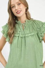 Sage green umgee ruffled flutter sleeve textured blouse with tie-front neckline and short flutter sleeves