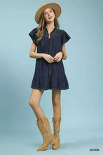 Navy blue umgee ruffled washed denim dress with button front, ruffled sleeves and hem, and subtle neckline embroidery