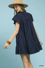 Navy blue umgee ruffled washed denim dress featuring a ruffled neckline and hem in soft washed denim fabric
