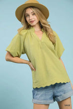 Sage-colored umgee scalloped hem textured blouse with short sleeves and gathered neckline for elegant wear