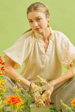 Cream-colored umgee scalloped hem textured blouse with loose fit and short flutter sleeves in subtle fabric