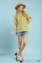 Umgee sage green short-sleeved hem textured blouse with scalloped hem and subtle textured fabric detail