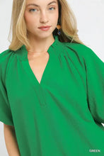 Vibrant green umgee scalloped hem textured blouse with soft flowing fabric and flattering v neckline