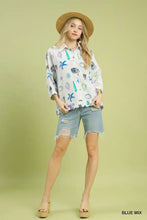 White button-down shirt by umgee with sea-themed starfish print in blue and green seashells and coral design
