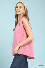 Pink sleeveless textured notch neck top by umgee with ruffled neckline and subtle pleats at the hem