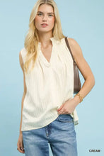 Cream-colored umgee sleeveless textured gauze top with v-neckline and subtle pleats for a stylish look