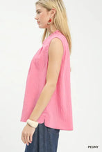 Umgee sleeveless textured gauze top in soft pink with a ruffled split neck and subtle vertical pleats