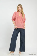 Coral pink umgee smocked yoke blouse with ruffle sleeves and gathered neckline in lightweight fabric