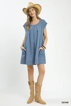 Blue stone washed denim mini dress by Umgee with short sleeves and front pockets in a casual denim mini style