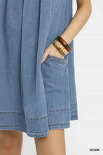 Light blue Umgee stone washed denim mini dress with relaxed sleeveless fit and visible stitching details