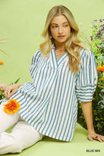 Umgee striped puff sleeve blouse in blue and white vertical stripes with v-neckline and three-quarter puff sleeves