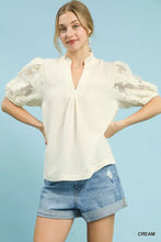 Cream-colored Umgee textured blouse with puff sleeves featuring lace detailing and a textured fabric bodice