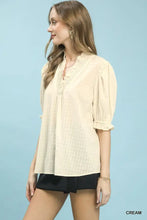Cream-colored lightweight Umgee textured check ruffle blouse with subtle check pattern and ruffled neckline and sleeves