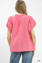 Pink umgee textured gauze blouse with puffed short sleeves and ruffle neck detail in boho style