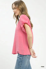 A soft pink umgee textured gauze ruffle neck top with puffed short sleeves and a relaxed fit cotton fabric