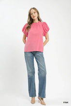 A vibrant pink umgee textured gauze ruffle neck blouse with ribbed fabric and puffy short sleeves