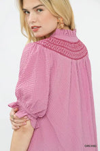 Pink umgee textured henley blouse with high ruffled neckline and intricate embroidered detailing