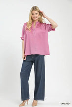 Umgee textured henley blouse in soft pink with textured fabric ruffled short sleeves and buttoned front closure
