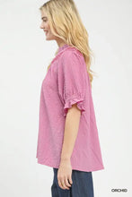 Soft pink umgee textured henley blouse with ruffled short sleeves and delicate embroidered neckline