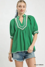 Kelly green umgee textured jacquard blouse with white jacquard contrast trim and puffed sleeves