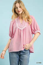 Umgee soft pink textured jacquard contrast trim top with v-neckline and delicate lace trim along neckline and cuffs