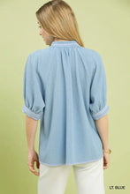 Light blue Umgee textured jacquard contrast trim blouse with rolled sleeves and subtle striped collar detail
