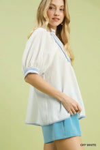 Off white umgee textured jacquard blouse with light blue jacquard contrast trim on neckline and cuffs