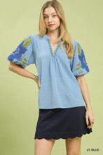 Light blue umgee textured jacquard blouse with puff sleeves floral embroidery and jacquard v neck detail