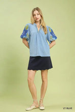 Light blue umgee textured jacquard blouse with puff sleeves scalloped hem and jacquard v neck design