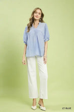 Light blue soft cotton umgee blouse with ruffled sleeves gathered neckline and textured lace trim details