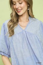 Light blue umgee textured lace trim v-neck boho blouse with puffed short sleeves and delicate lace trim detailing