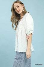 Off-white umgee blouse with textured lace trim v-neck puffed sleeves and relaxed fit boho style