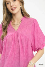Umgee textured lace trim boho blouse in vibrant pink with v-neckline and puffed sleeves featuring textured lace trim