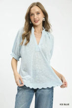 Ice blue umgee textured pintuck blouse with v-neck and scalloped hem in lightweight fabric