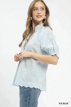 Ice blue umgee textured pintuck blouse with puffed sleeves and scalloped hem featuring delicate embroidery