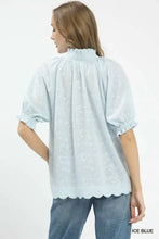 Ice blue umgee textured pintuck blouse with embroidery, puffed sleeves, and scalloped hem for elegant wear