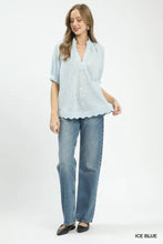 Ice blue umgee textured pintuck blouse with v-neck and scalloped hem in lightweight fabric for elegant wear