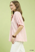 Umgee textured pintuck blouse in soft light pink with a subtle textured weave and puffed short sleeves with ruffled cuffs