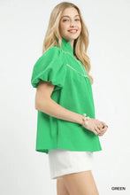 Bright green umgee textured puff sleeve blouse with high neckline and puffy short sleeves in textured puff design